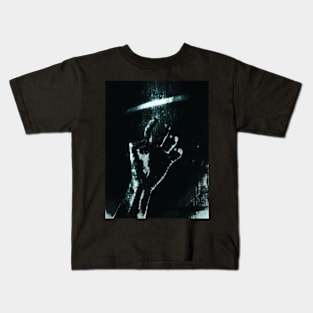 Digital collage and special processing. Person looking on his hand. Bizarre, dark. Grayscale and aquamarine. High contrast. Kids T-Shirt